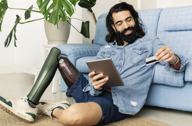 Man with robotic leg donating via online form