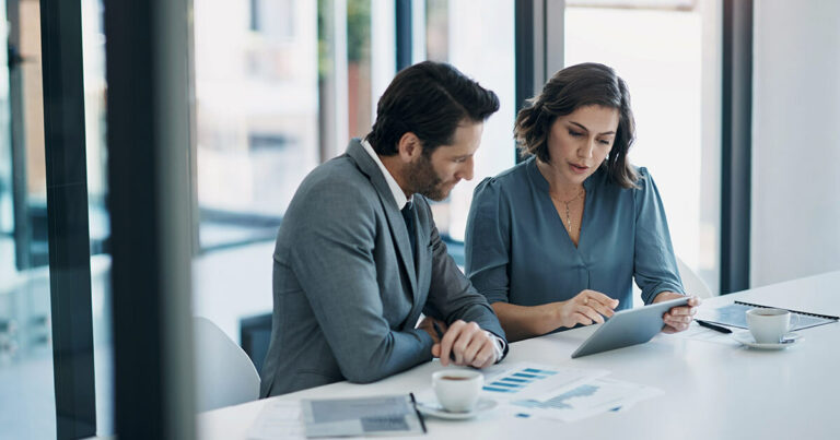 Two people discussing corporate giving.