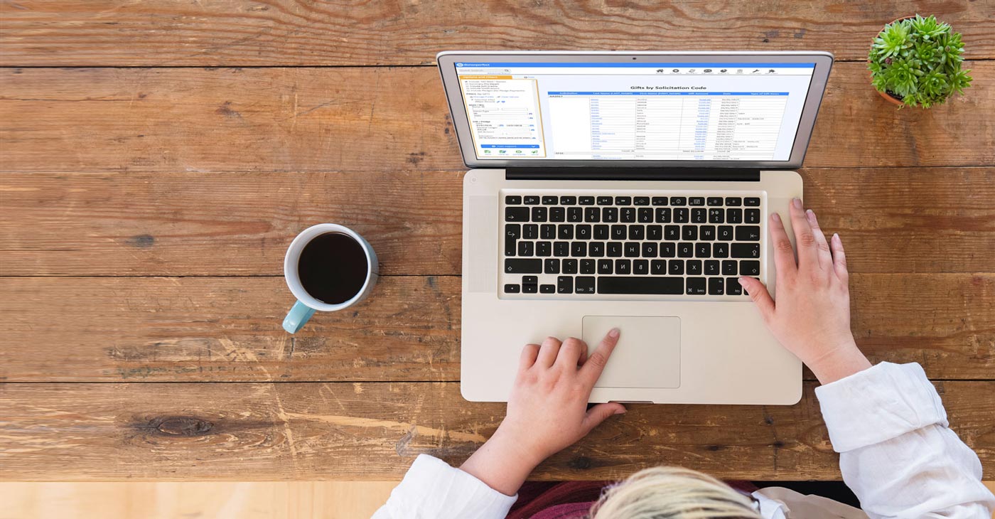 Custom Reporting Hero, lady on laptop with coffee