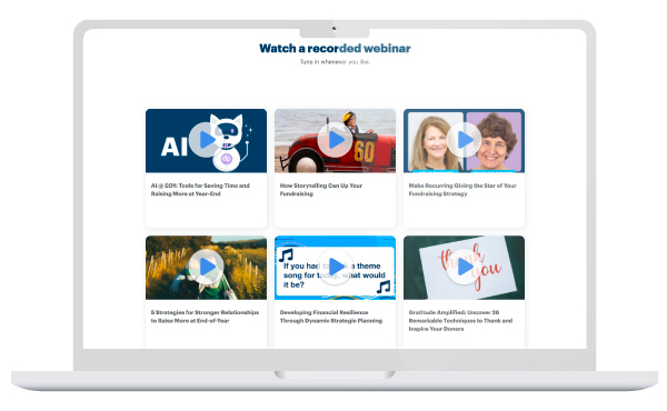A laptop with DonorPerfect webinars on the screen.