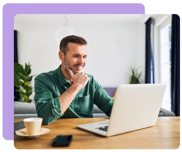 Guy smiling at computer