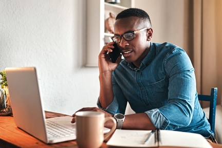 Person talking on phone with DonorPerfects onboarding team