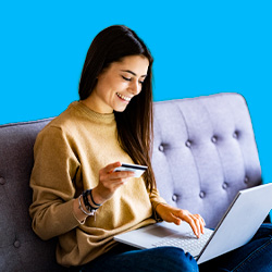 Woman making a last minute donation through her laptop.