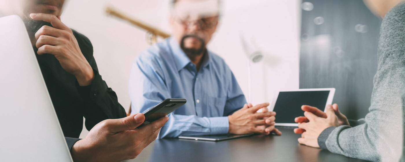 people looking at phones