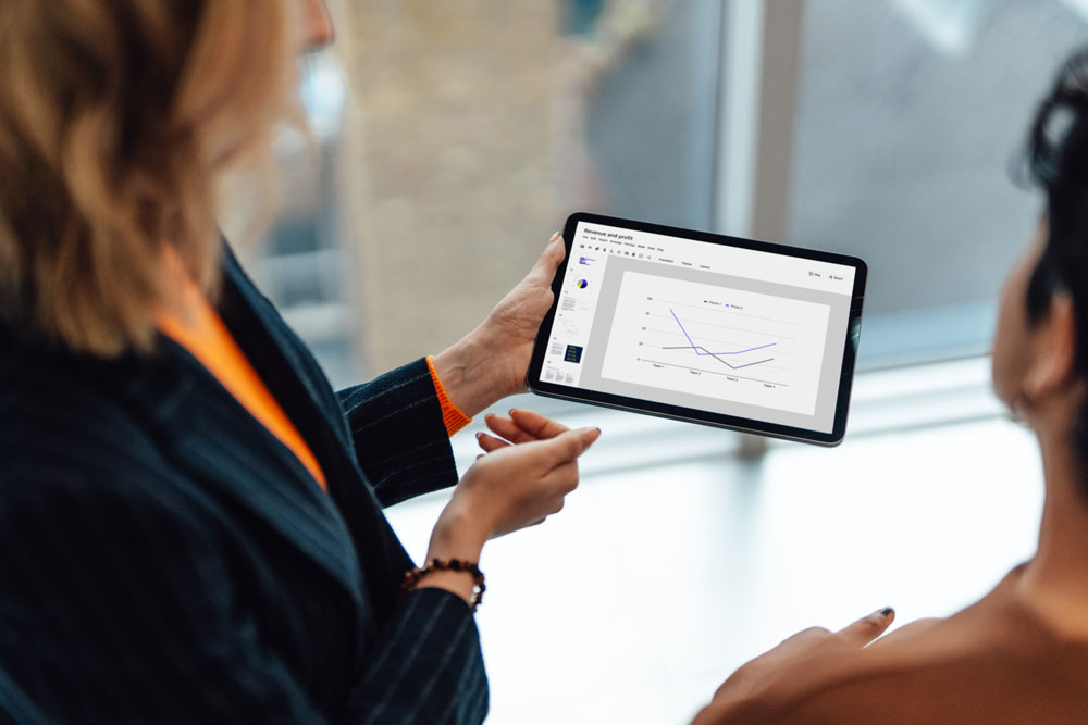 people reviewing data on ipad