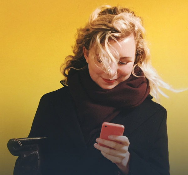 donor checking phone for updates about Giving Tuesday