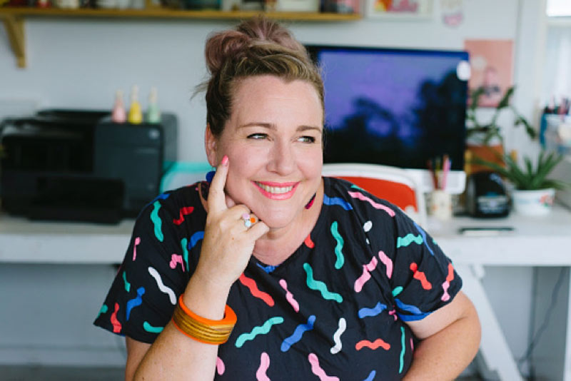 Nonprofit worker smiling at work in an office space