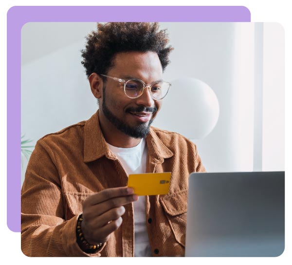 Smiling businessman making donation with credit card