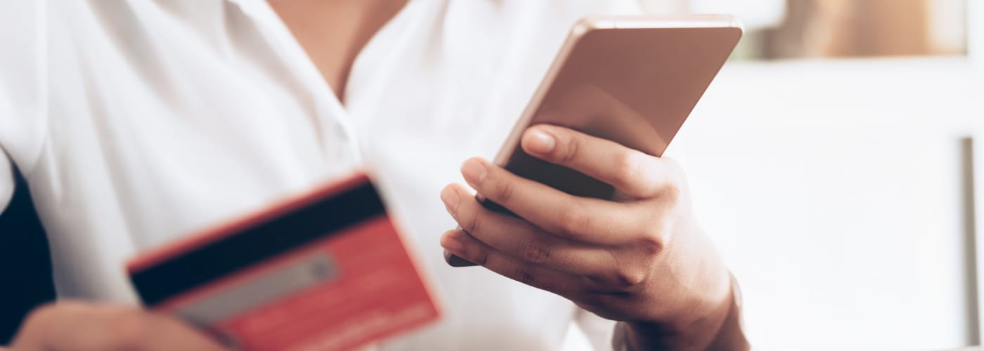 lady paying with credit card on phone