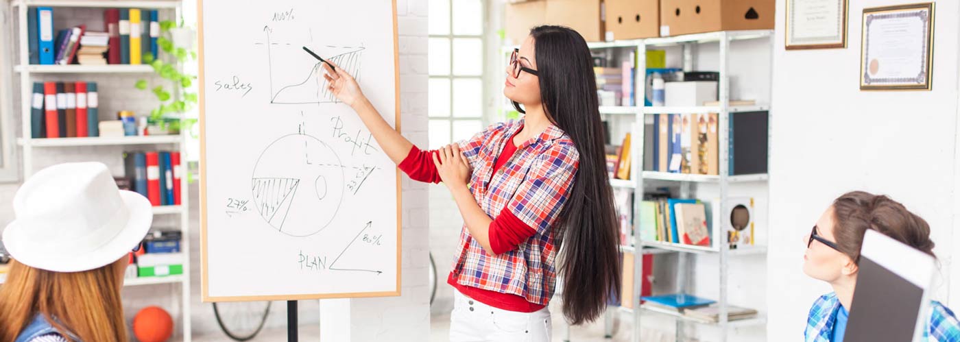 Person pointing on whiteboard
