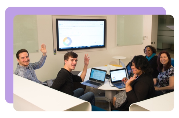 DonorPerfect team working together looking at data