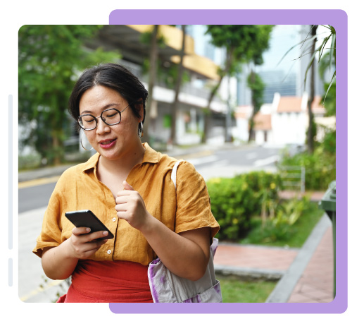 Lady walking and reading message on phone