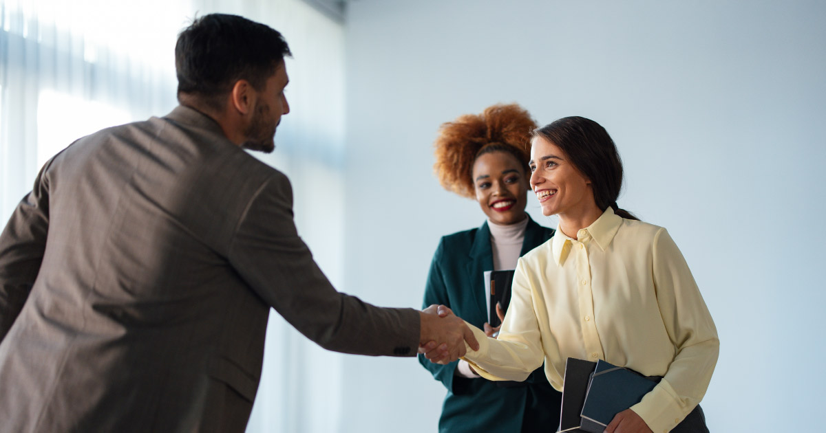People shaking hands meeting