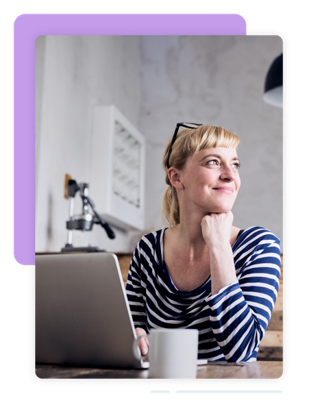 Woman smiling at computer