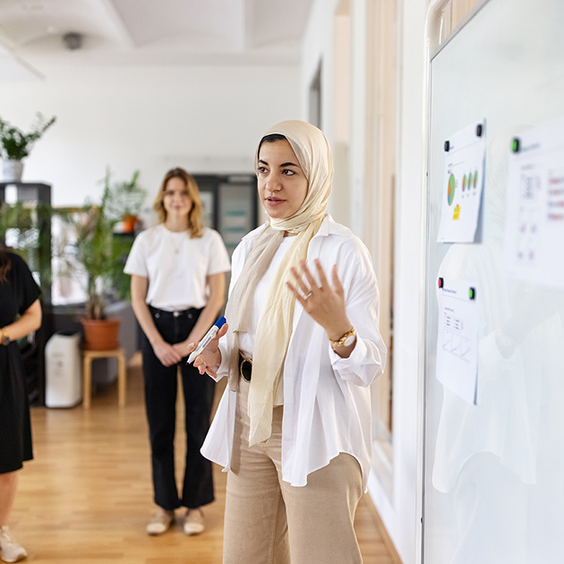 A nonprofit leader presenting to coworkers.