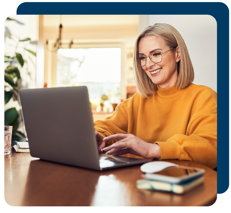 Woman on computer smiling