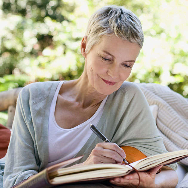 A woman writing grants.