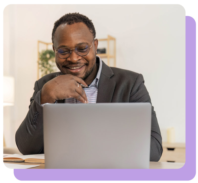 Worker on laptop smiling