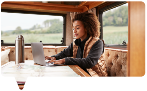 Woman with map, using laptop